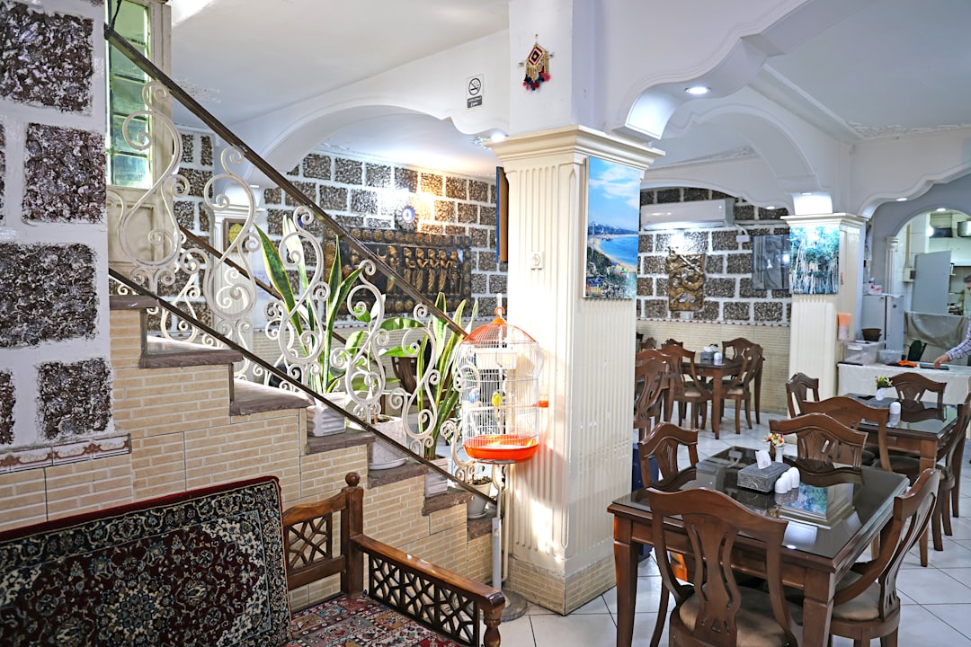 restaurant-interior-with-tables-chairs-and-staircase-4msn0avq-i