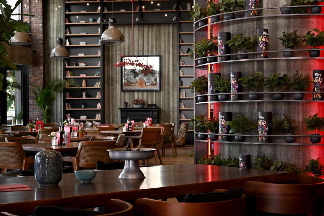 interior-of-a-modern-restaurant-with-plants-and-shelves-udaskrxyroa